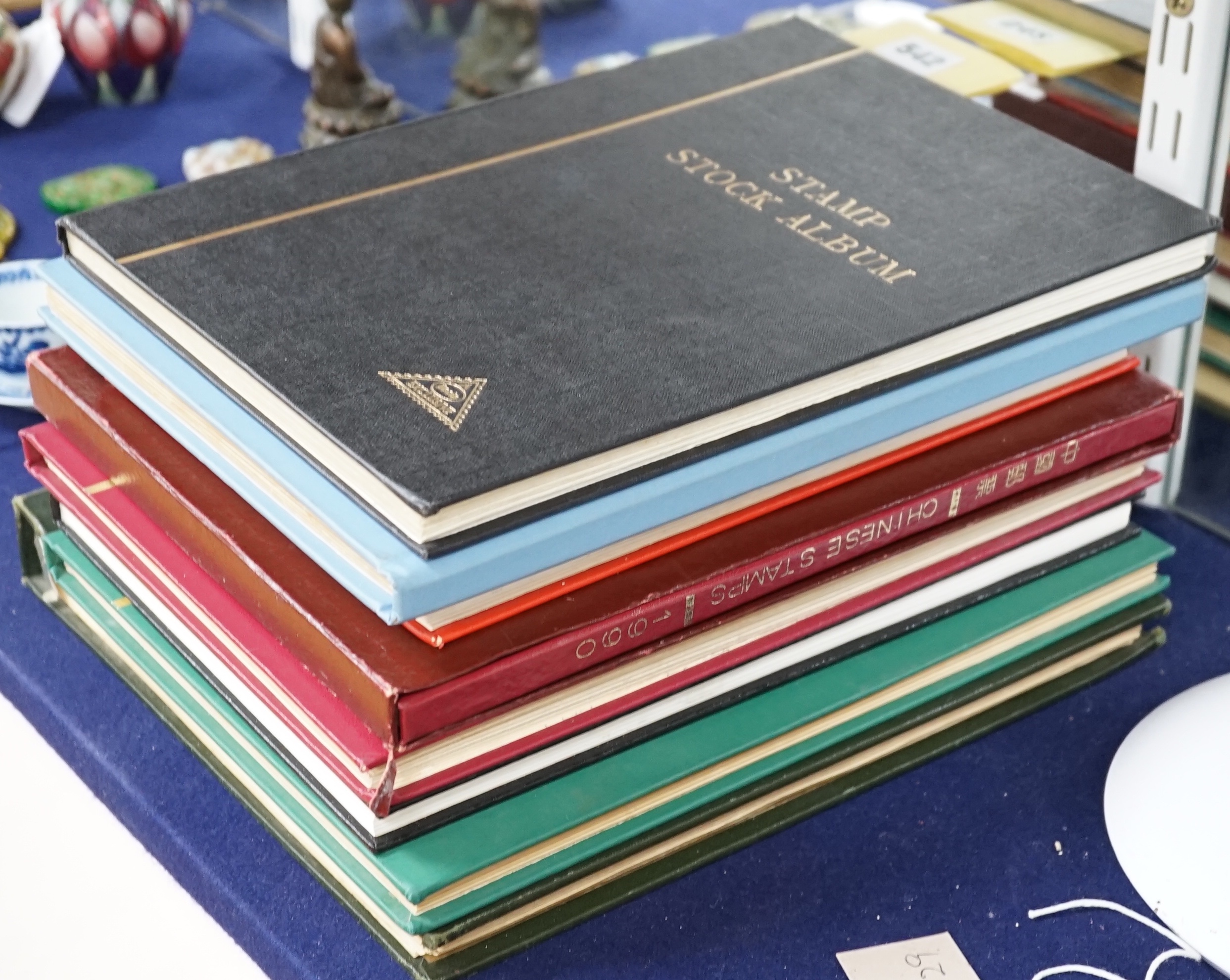 World stamps in 8 albums, stock books with Great Britain from 1840 1d black, 1841 2d blue, China1990 stamps in year book, British colonies